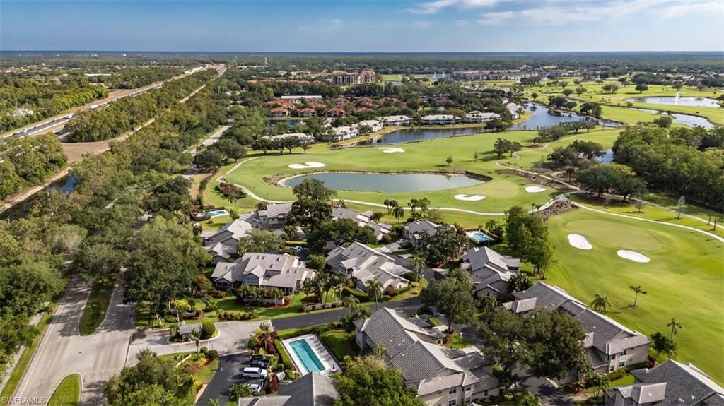 164 Via Perignon, Unit 84 Naples, FL 34119 - Photo 32 of 34 an aerial view of residential houses with outdoor space