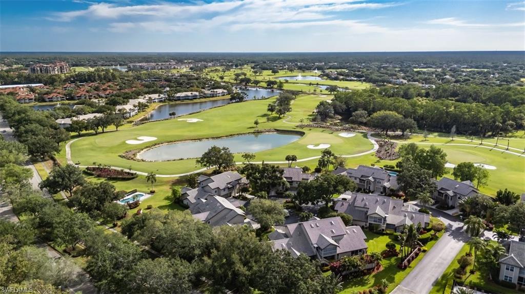 164 Via Perignon, Unit 84 Naples, FL 34119 - Photo 33 of 34 an aerial view of residential houses with outdoor space