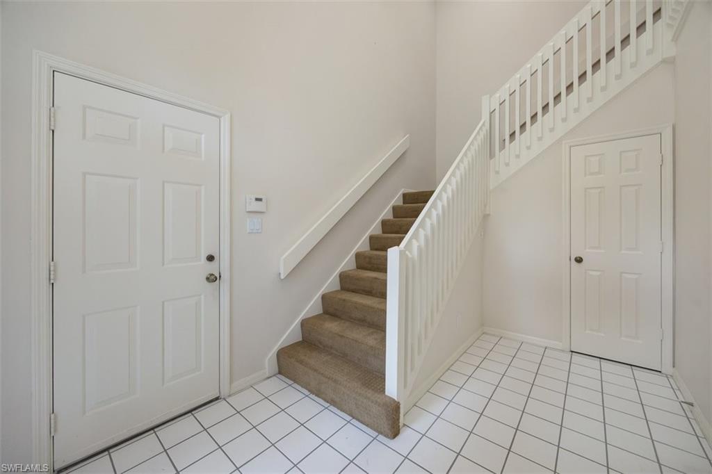 164 Via Perignon, Unit 84 Naples, FL 34119 - Photo 7 of 34 a view of an entryway with staircase