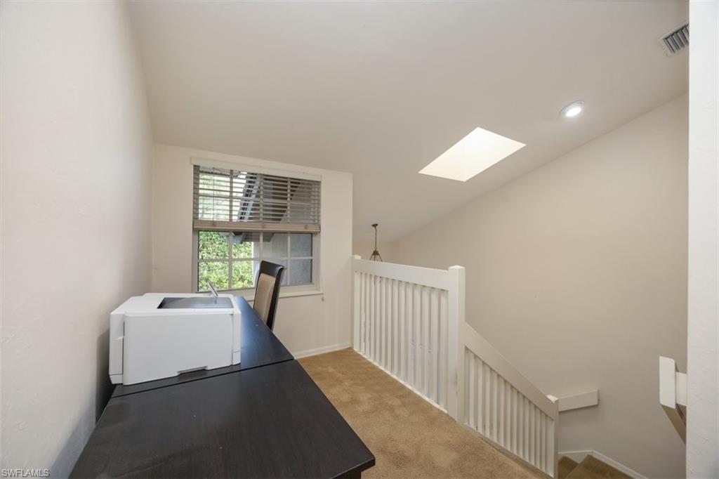 164 Via Perignon, Unit 84 Naples, FL 34119 - Photo 8 of 34 a living room with furniture and a window