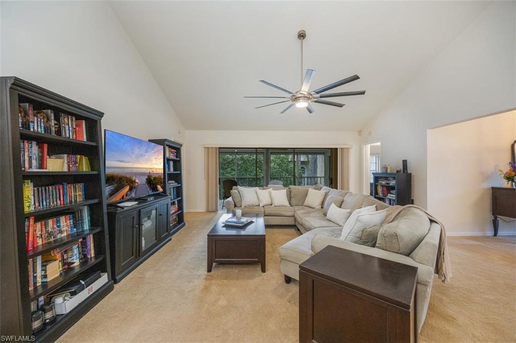 164 Via Perignon, Unit 84 Naples, FL 34119 - Photo 9 of 34 a living room with furniture a view of bedroom and a window