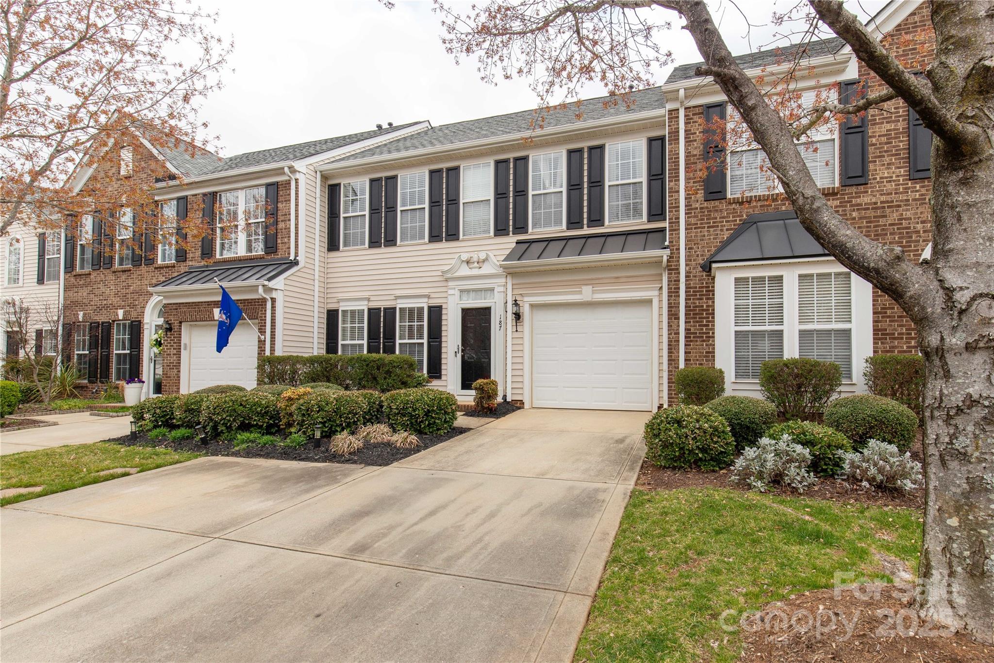 187 Snead Road Fort Mill, SC 29715 - Photo 1 of 32 a front view of a house with garden