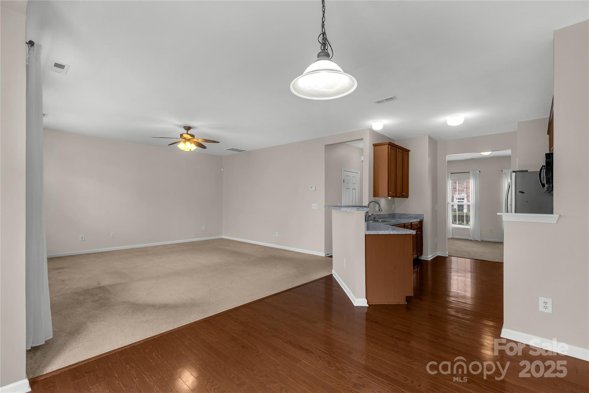 187 Snead Road Fort Mill, SC 29715 - Photo 11 of 32 a view of kitchen with microwave and cabinets