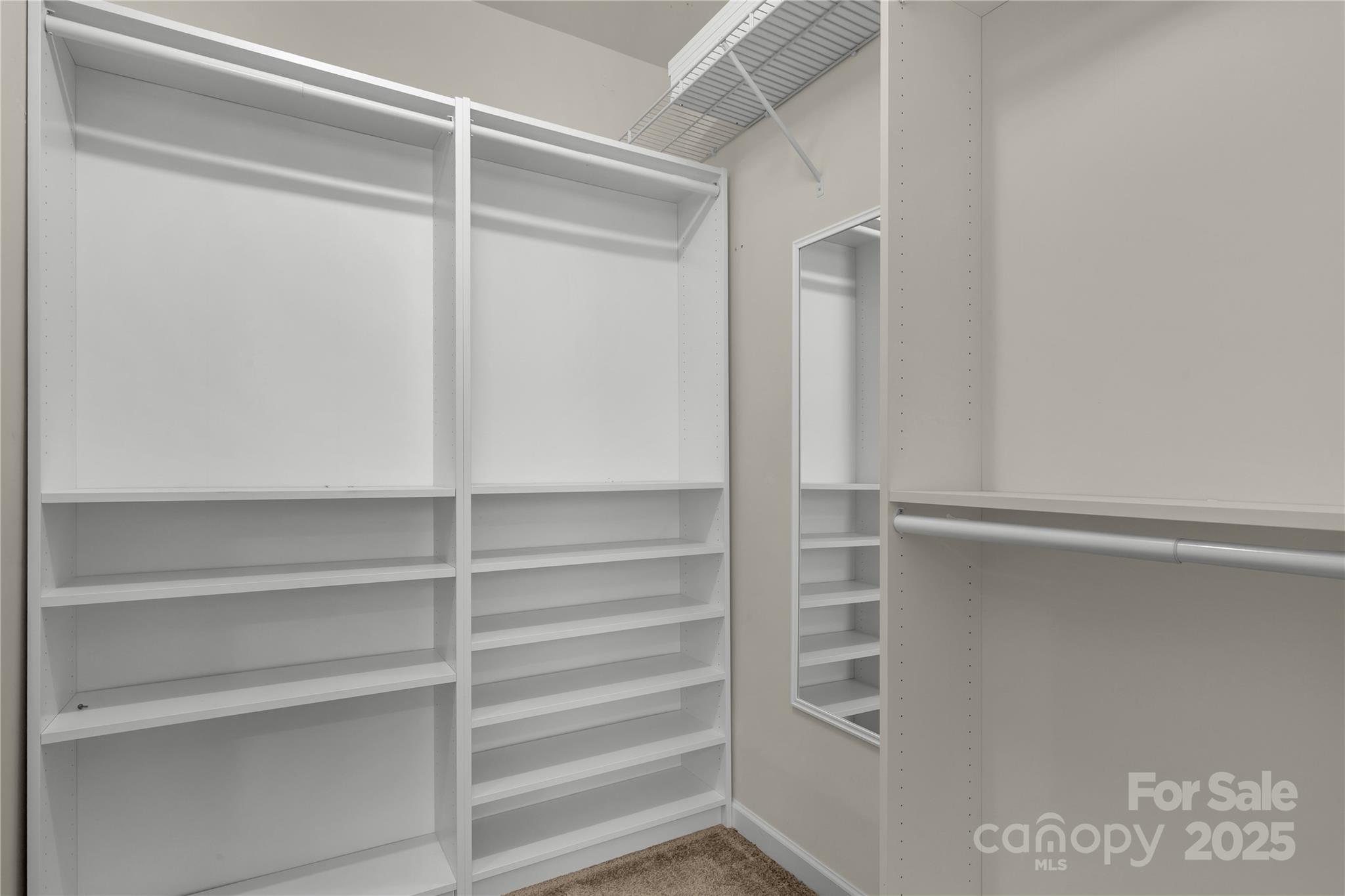 187 Snead Road Fort Mill, SC 29715 - Photo 19 of 32 a view of walk in closet with empty racks