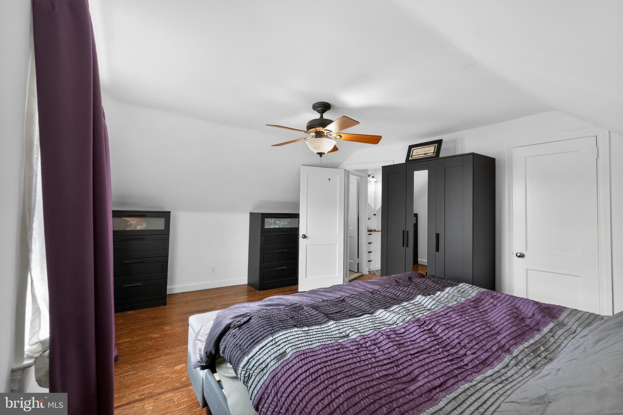 518 Bonsall Road Ridley Park, PA 19078 - Photo 17 of 31 a bedroom with a bed and a chandelier