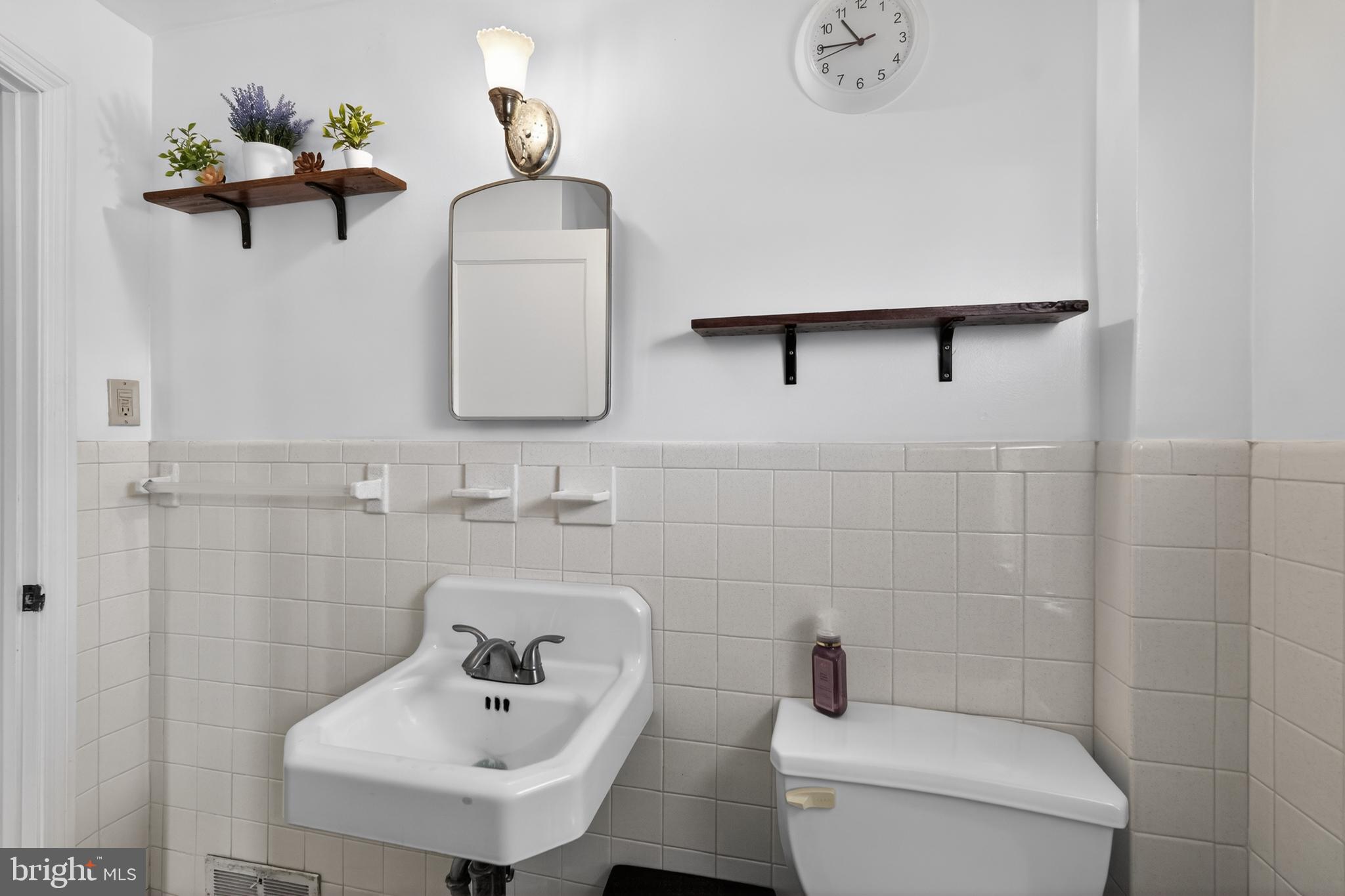 518 Bonsall Road Ridley Park, PA 19078 - Photo 19 of 31 a bathroom with a toilet sink and mirror