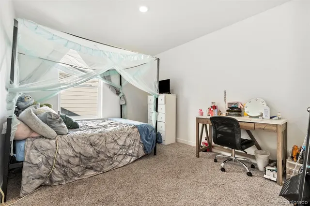 a bedroom with a workspace