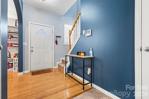 a view of an entryway with wooden floor