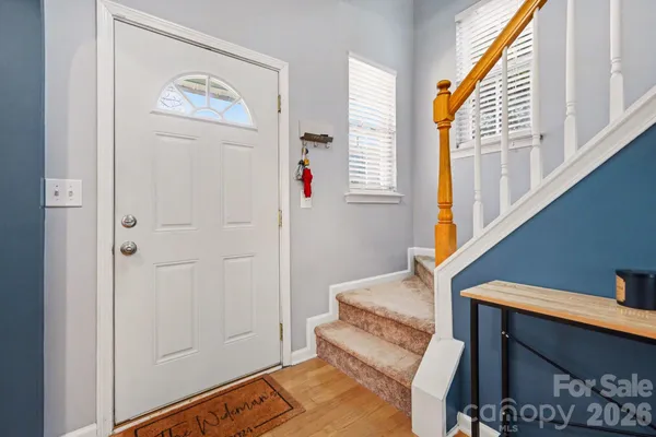 a view of entryway with stairs and a window