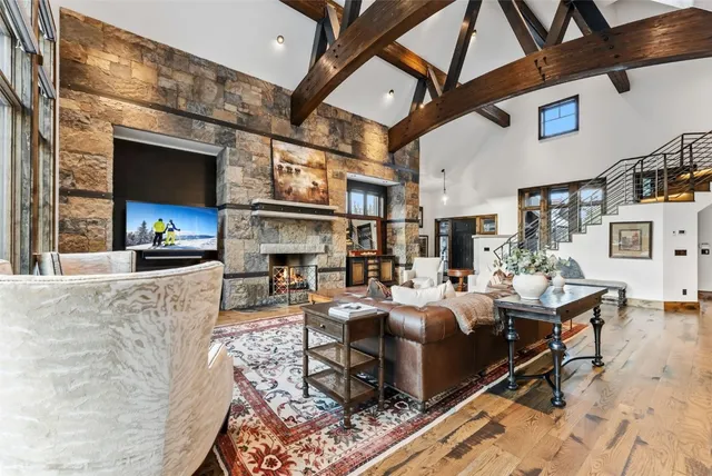a living room with fireplace furniture and a fireplace