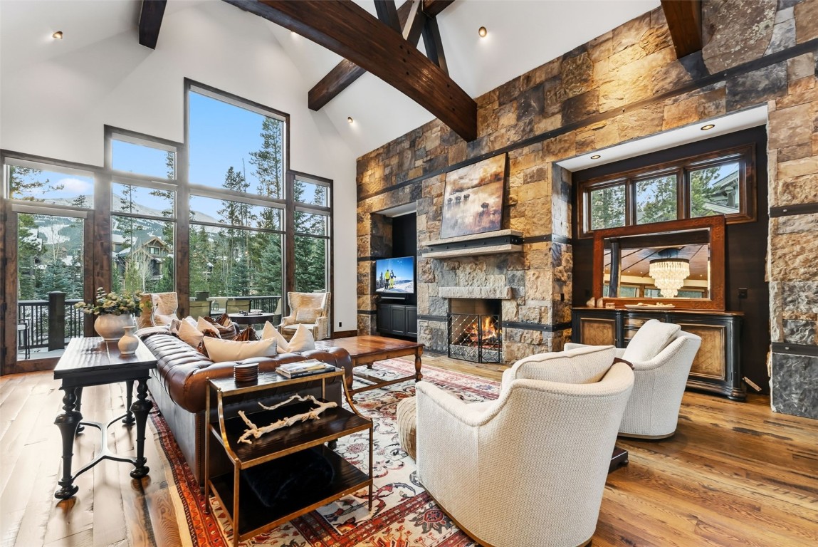 111 Brooks Snider Road Breckenridge, CO 80424 - Photo 12 of 44 a living room with furniture a fireplace and a floor to ceiling window