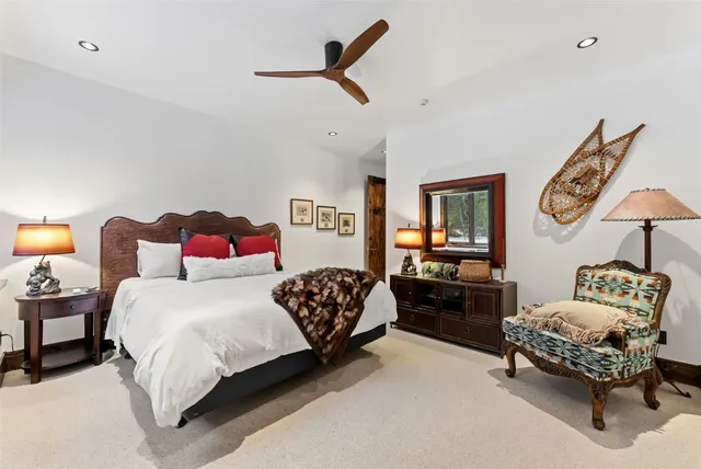 a bedroom with a bed bed and a chair