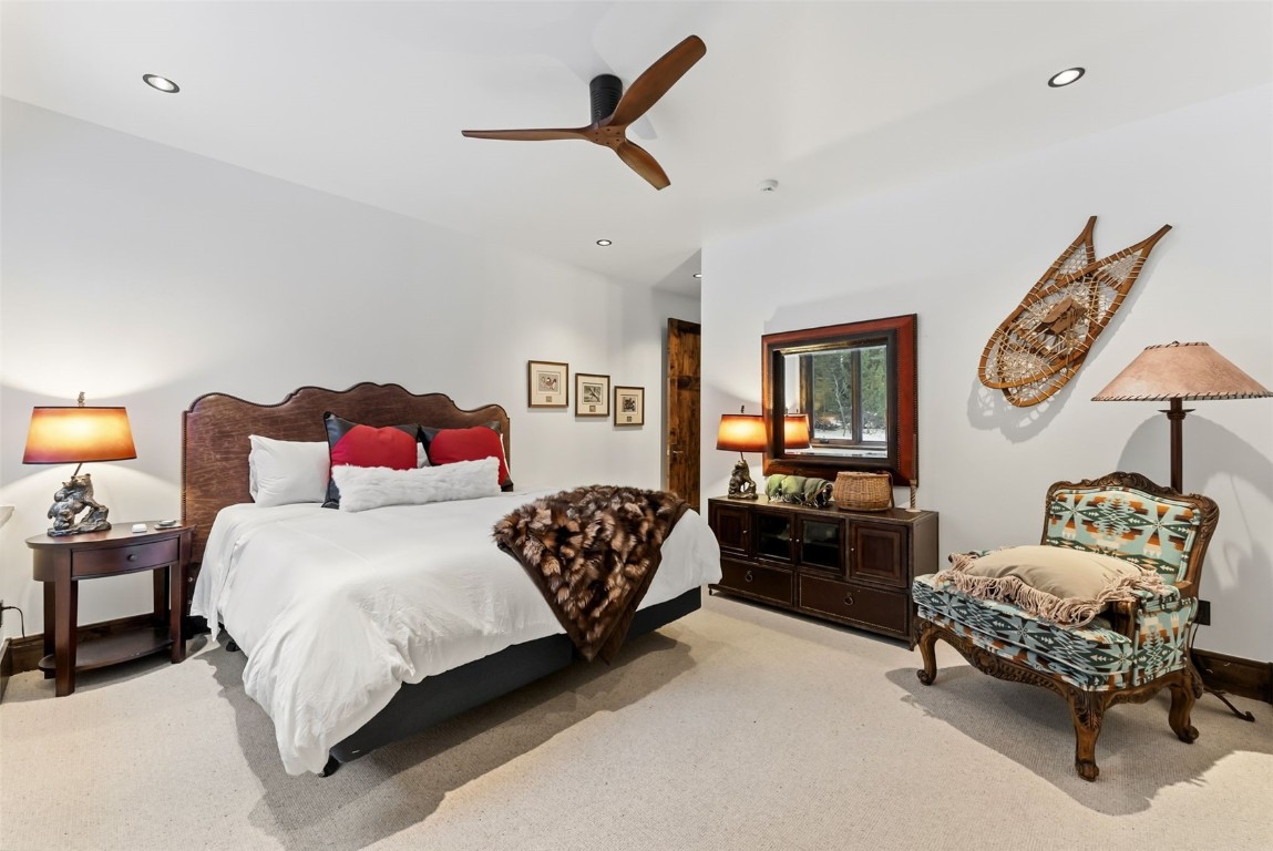 111 Brooks Snider Road Breckenridge, CO 80424 - Photo 23 of 44 a bedroom with a bed bed and a chair