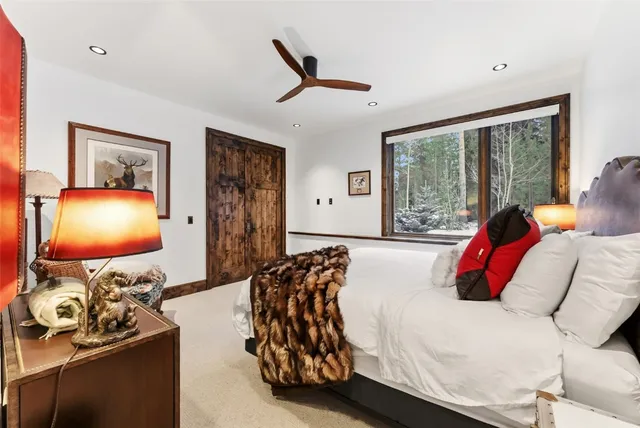 a bedroom with furniture and a flat screen tv