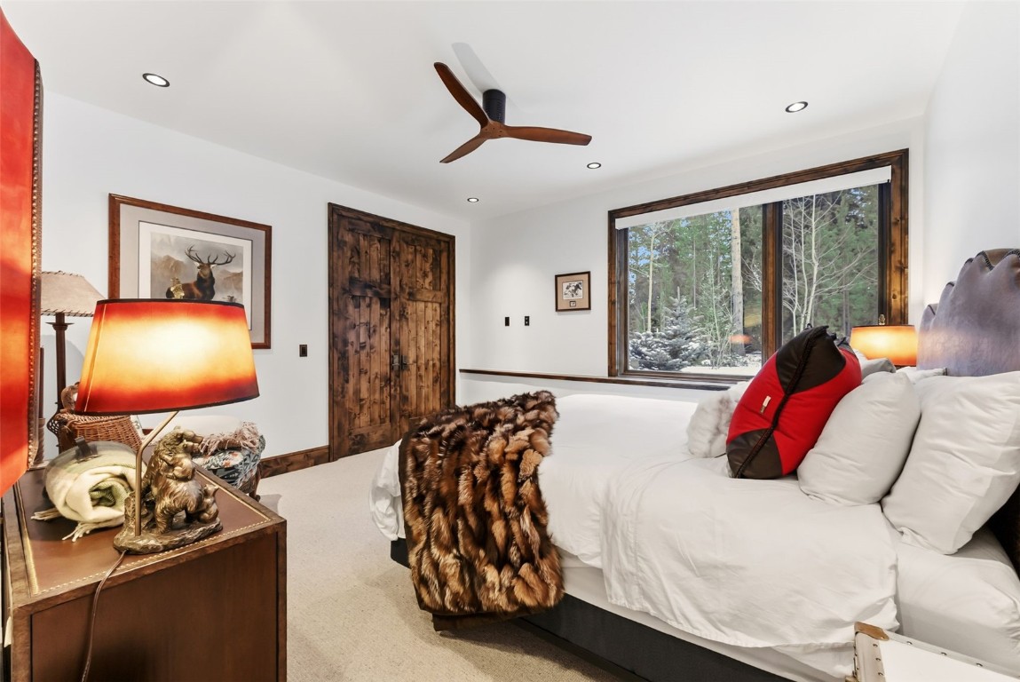 111 Brooks Snider Road Breckenridge, CO 80424 - Photo 24 of 44 a bedroom with furniture and a flat screen tv