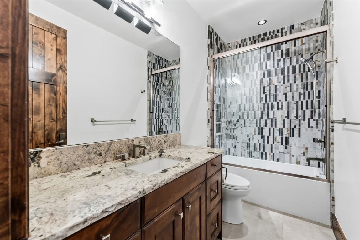 111 Brooks Snider Road Breckenridge, CO 80424 - Photo 25 of 44 a bathroom with a granite countertop sink a toilet and shower