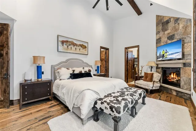 a bedroom with a bed and a fireplace