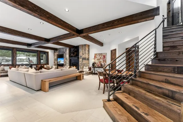 a living room with furniture and white walls