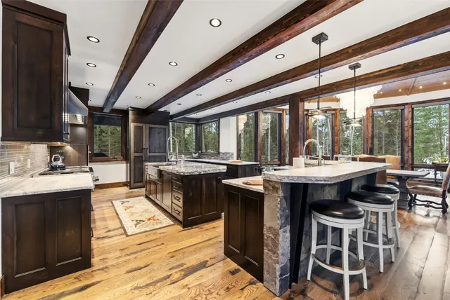 a kitchen with a sink and wooden cabinets