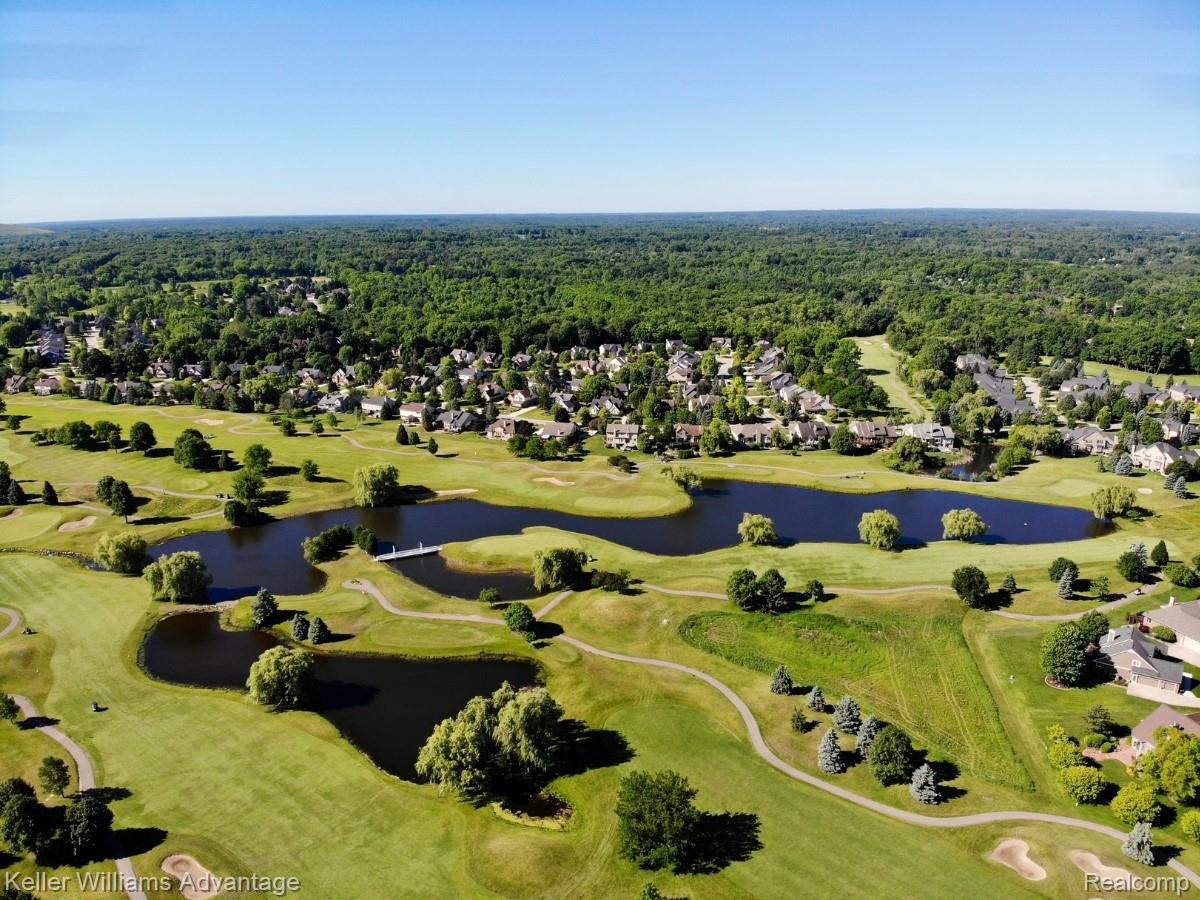 22878 Tree Top Court South Lyon, MI 48178 - Photo 68 of 75 Aerial perspective showcasing a residential community surrounded by expansive golf course terrain