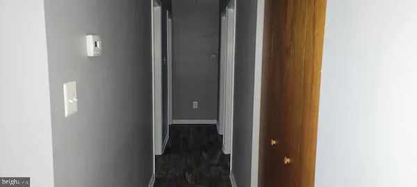 a view of a bathroom from a hallway