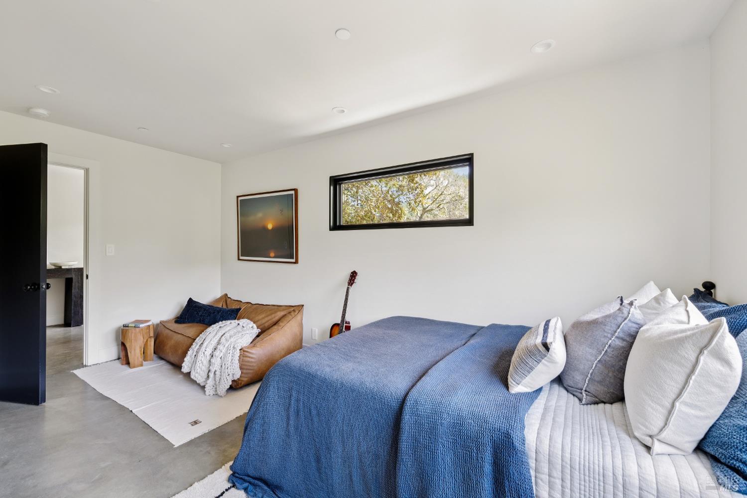 56 Millard Road Larkspur, CA 94939 - Photo 42 of 74 a bedroom with a bed and a flat screen tv