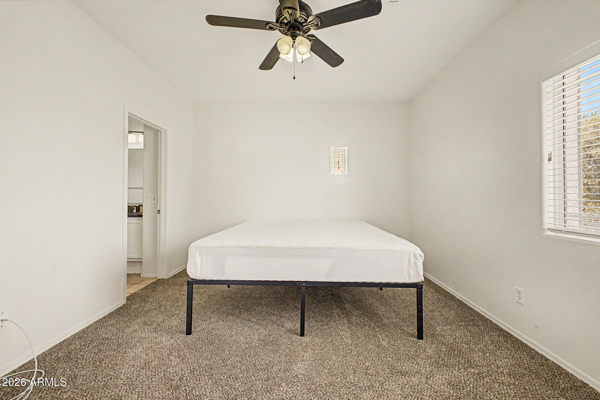 13261 West Redfield Road Surprise, AZ 85379 - Photo 23 of 36 a room that has a bed and a window