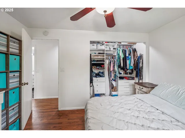 a bedroom with a bed and a walk in closet