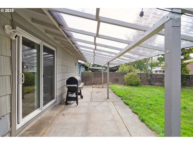an aerial view of a house with a garden and yard