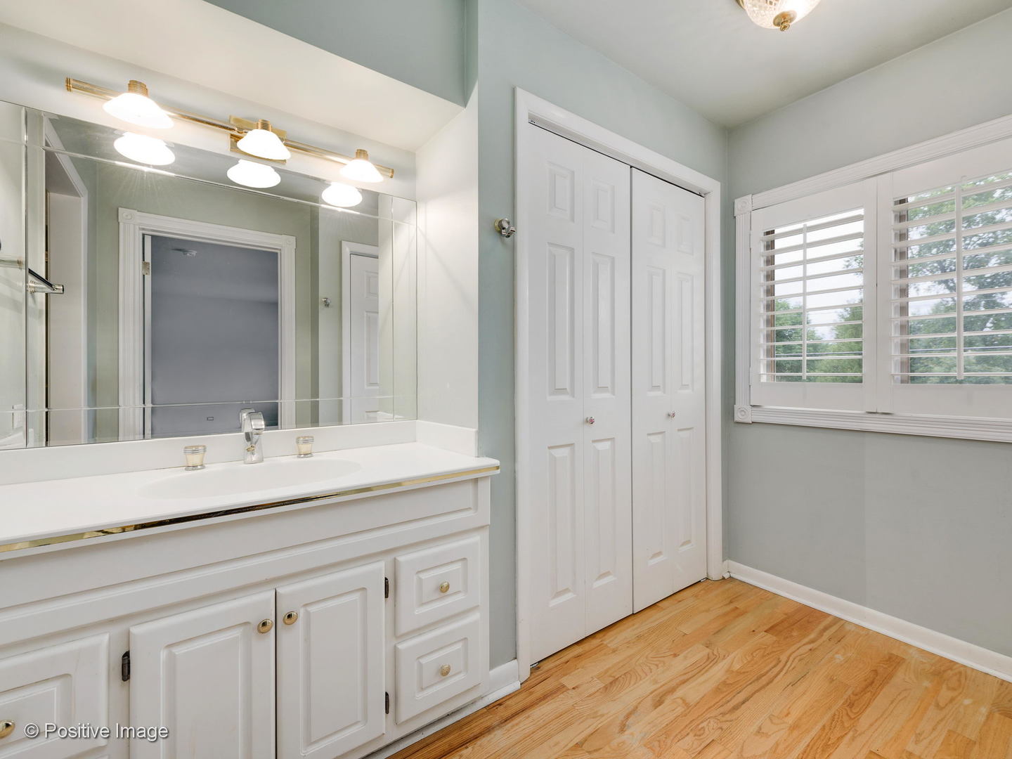 757 Ridge Road Highland Park, IL 60035 - Photo 14 of 26 a bathroom with a sink vanity and mirror