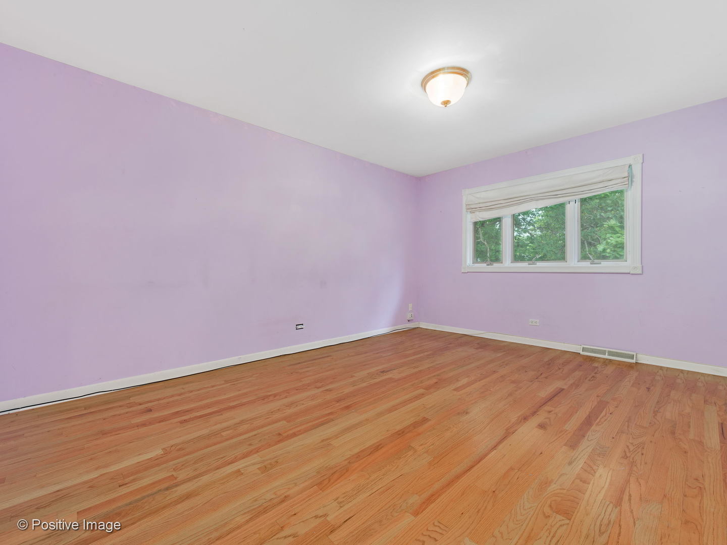 757 Ridge Road Highland Park, IL 60035 - Photo 17 of 26 a view of an empty room with wooden floor and a window