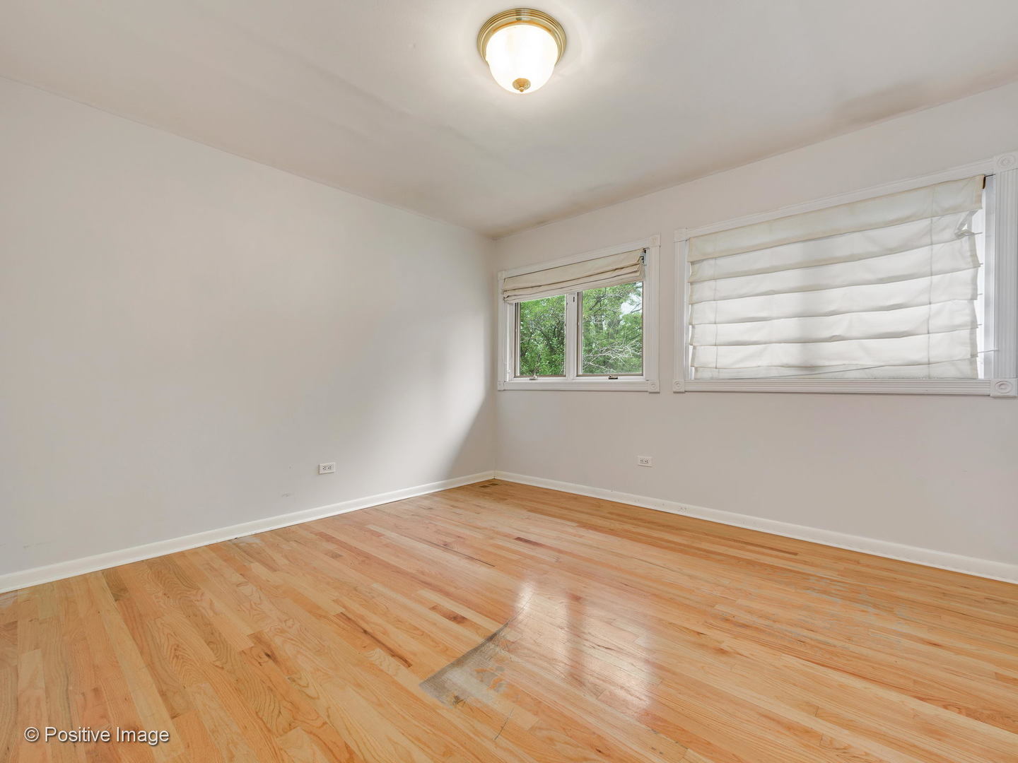 757 Ridge Road Highland Park, IL 60035 - Photo 18 of 26 an empty room with wooden floor and windows