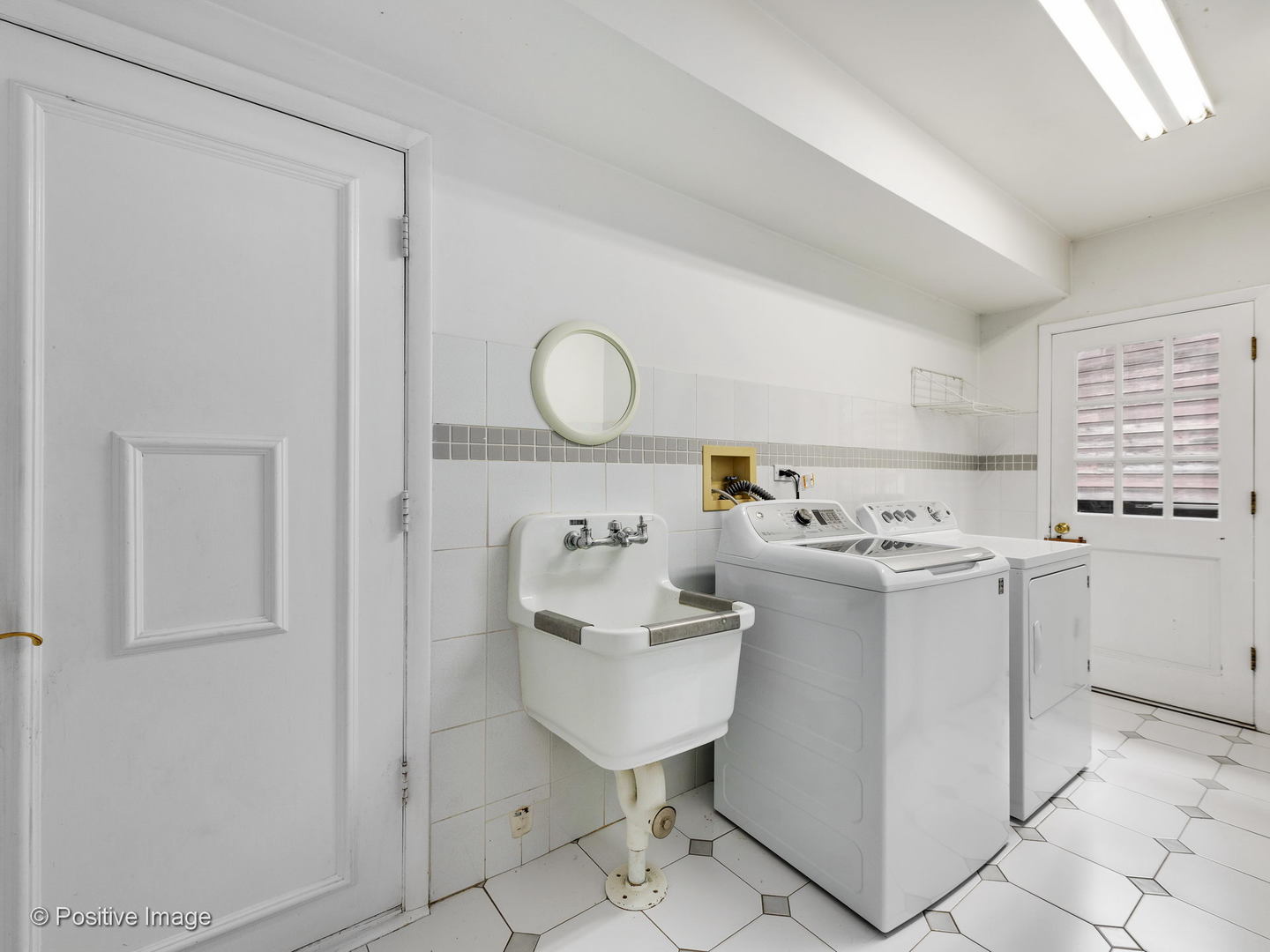 757 Ridge Road Highland Park, IL 60035 - Photo 20 of 26 a utility room with cabinets washer and dryer