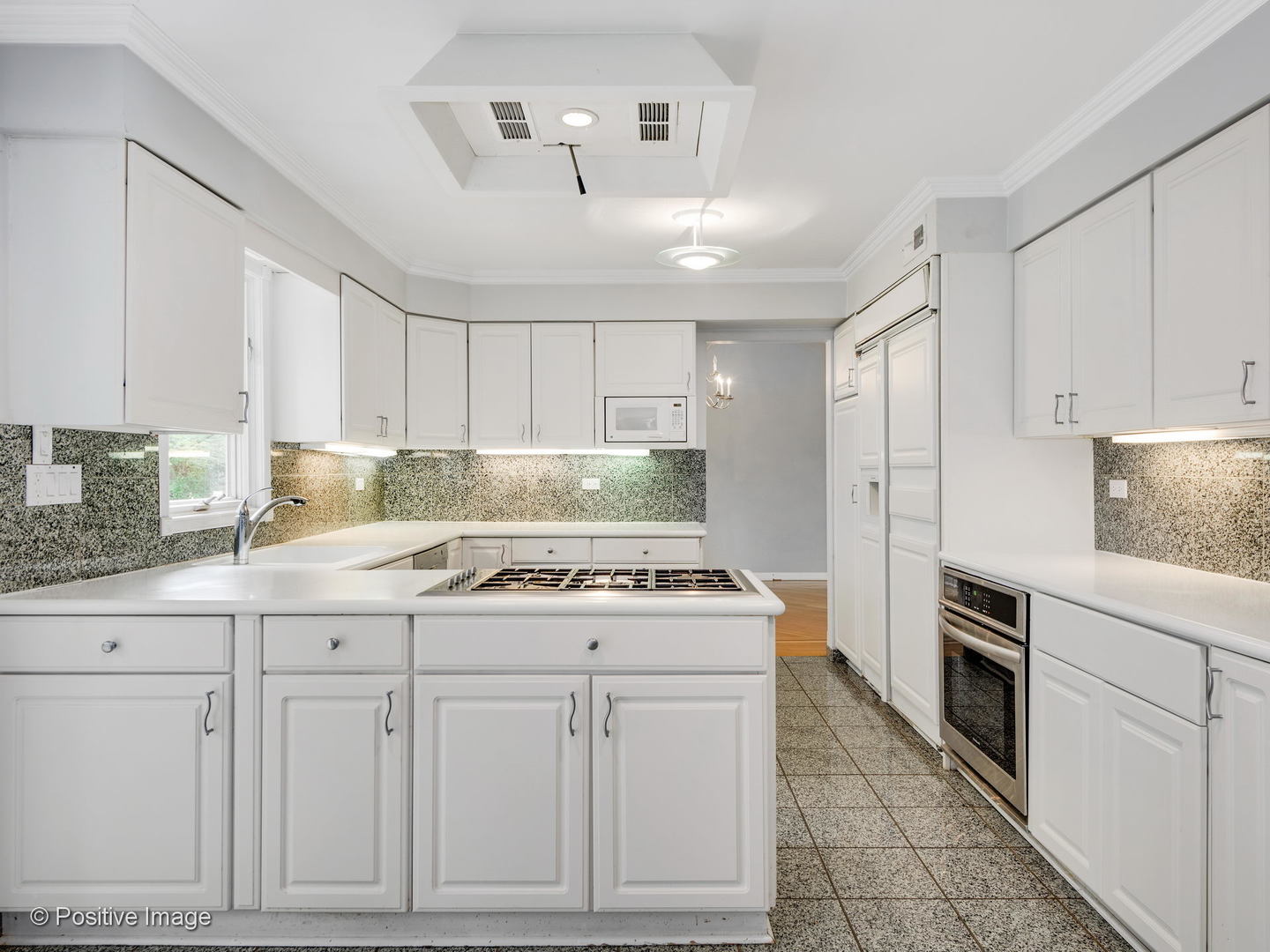 757 Ridge Road Highland Park, IL 60035 - Photo 6 of 26 a kitchen with white cabinets and white appliances