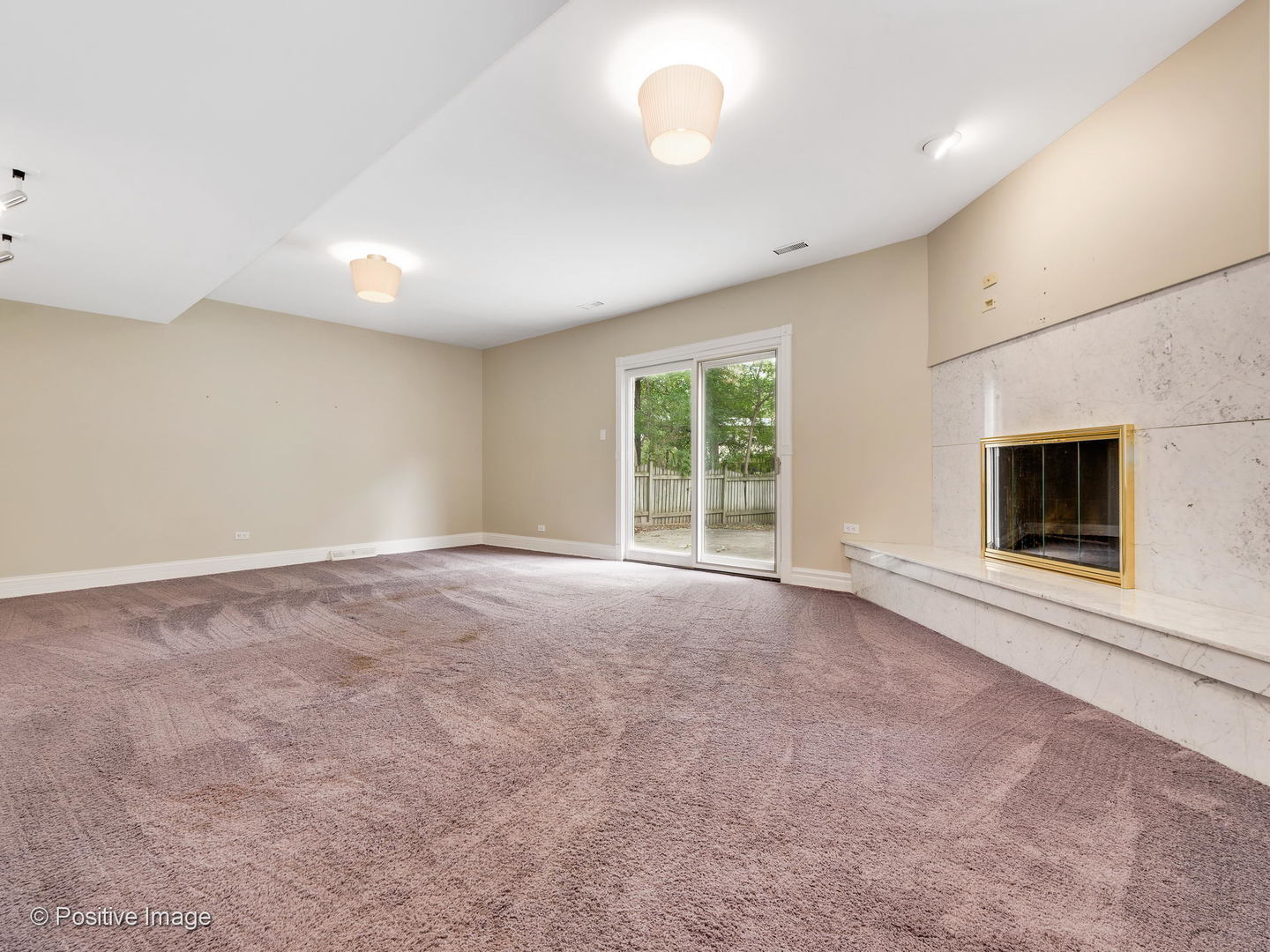 757 Ridge Road Highland Park, IL 60035 - Photo 9 of 26 a view of a livingroom with an empty space and a fireplace