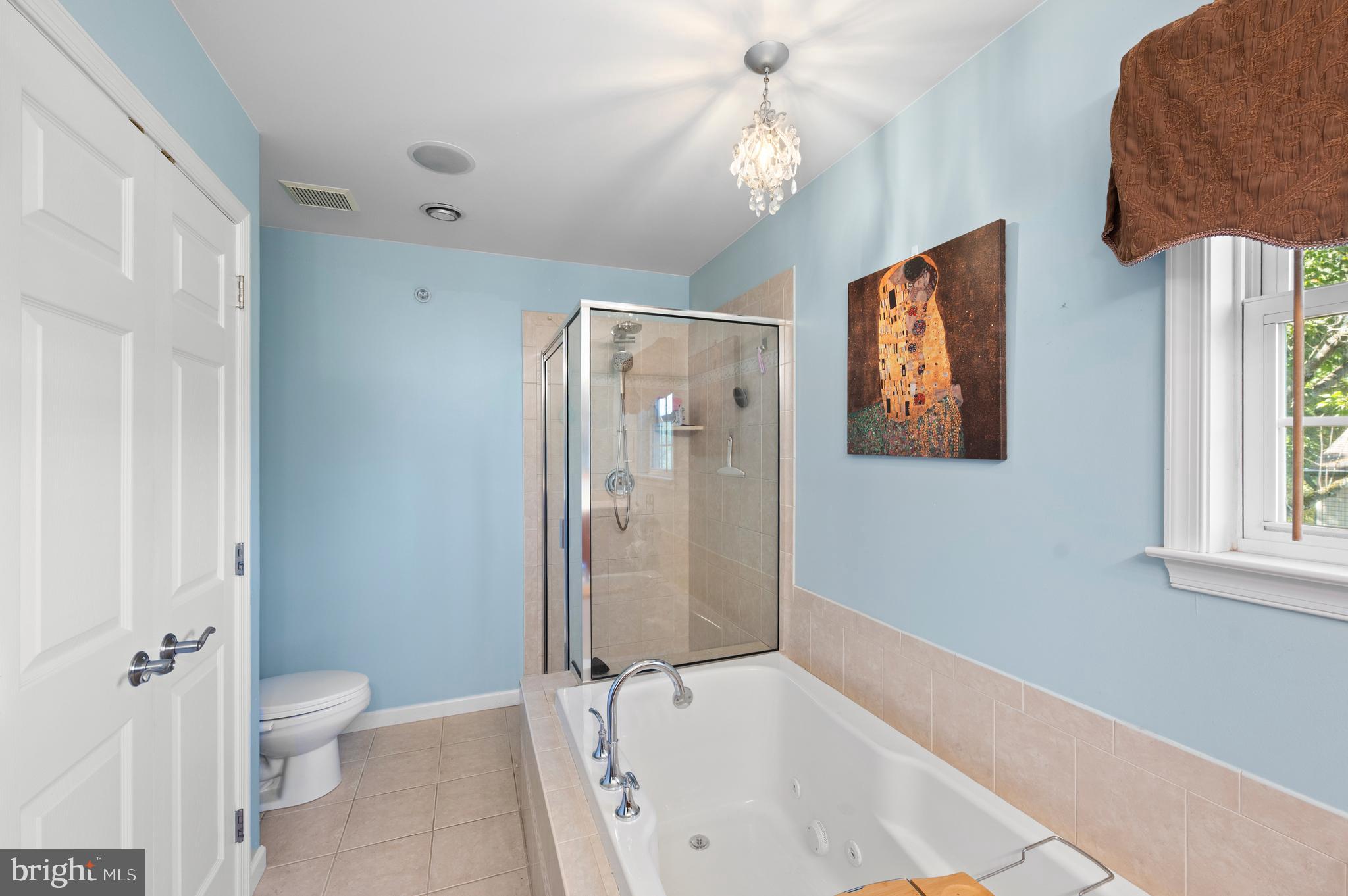 210 Main Street Newtown Square, PA 19073 - Photo 24 of 43 a bathroom with a bathtub and a shower