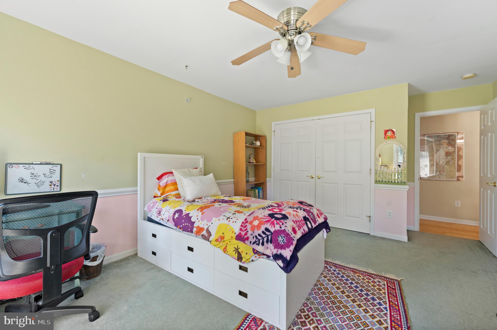 210 Main Street Newtown Square, PA 19073 - Photo 30 of 43 a bedroom with a bed and a chandelier