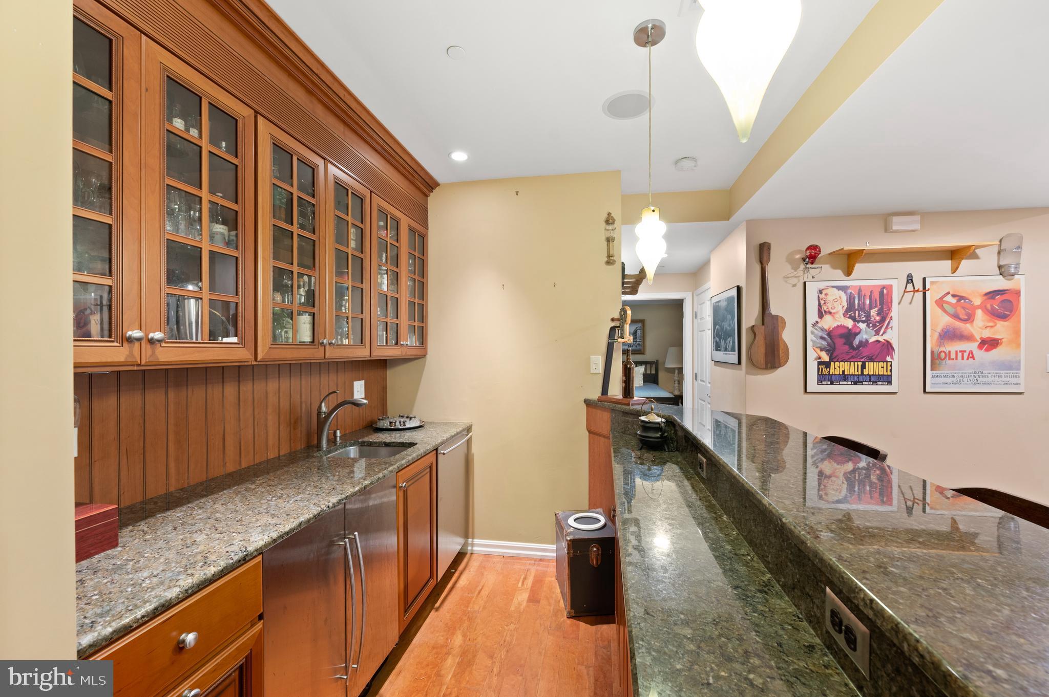 210 Main Street Newtown Square, PA 19073 - Photo 32 of 43 a kitchen with stainless steel appliances granite countertop a sink stove and cabinets