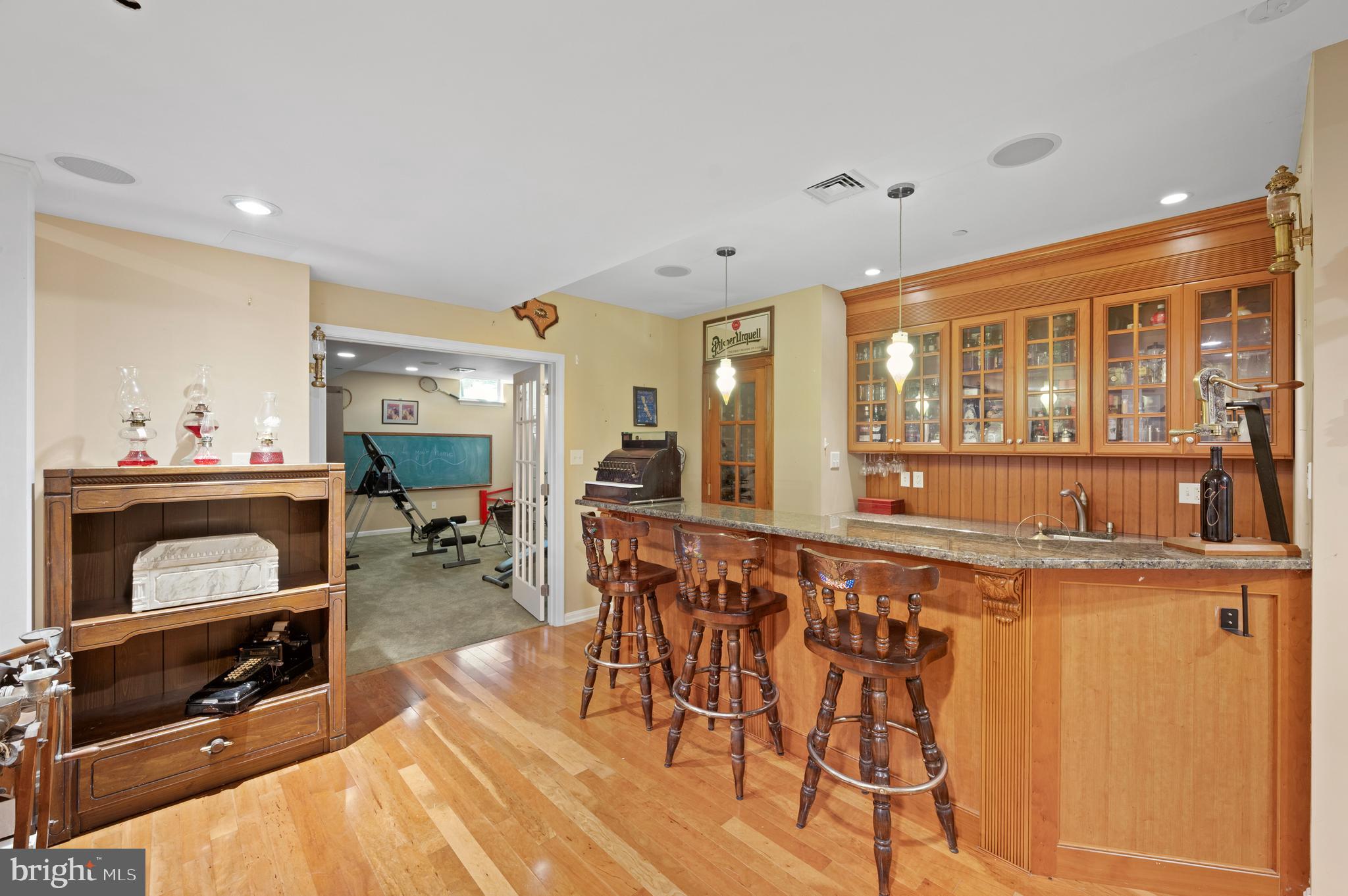 210 Main Street Newtown Square, PA 19073 - Photo 35 of 43 a living room with furniture a flat screen tv and a floor to ceiling window