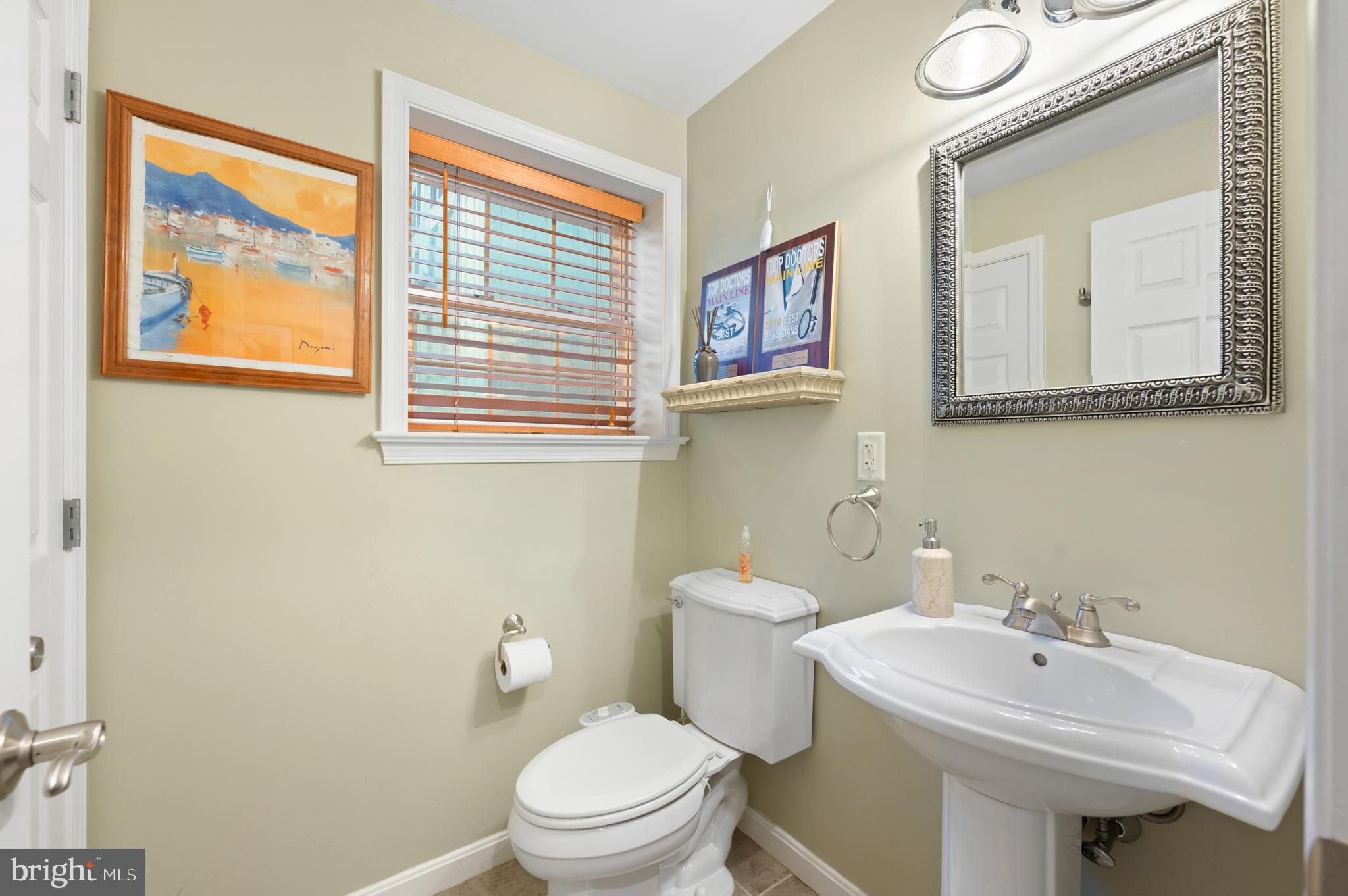 210 Main Street Newtown Square, PA 19073 - Photo 39 of 43 a bathroom with a toilet a sink and mirror