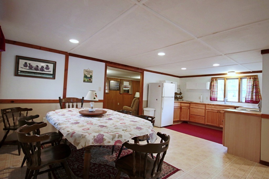 1 Bisson Lane Merrimac, MA 01860 - Photo 12 of 30 a large kitchen with dining table and chairs