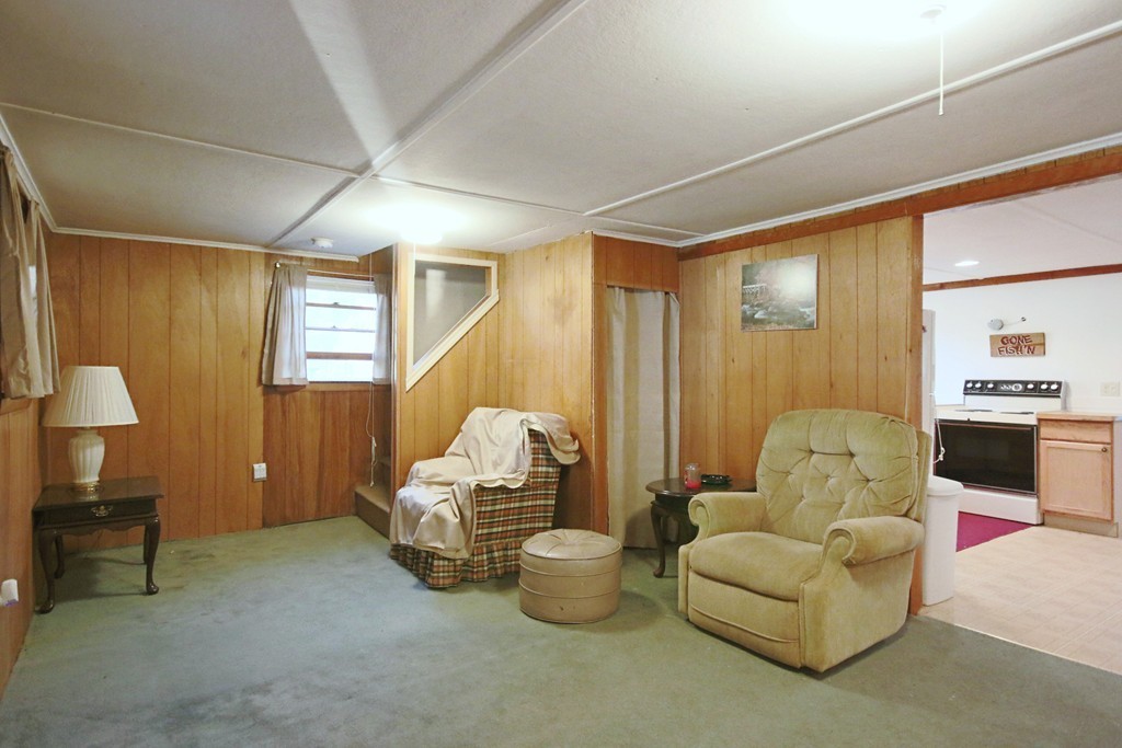 1 Bisson Lane Merrimac, MA 01860 - Photo 14 of 30 a living room with furniture and a chandelier