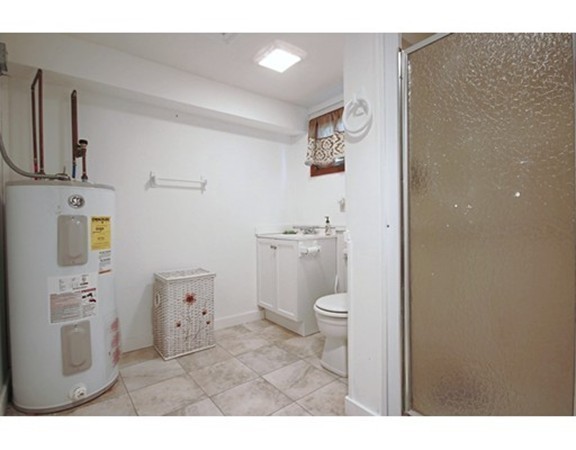 1 Bisson Lane Merrimac, MA 01860 - Photo 21 of 30 a bathroom with a sink a toilet and a mirror