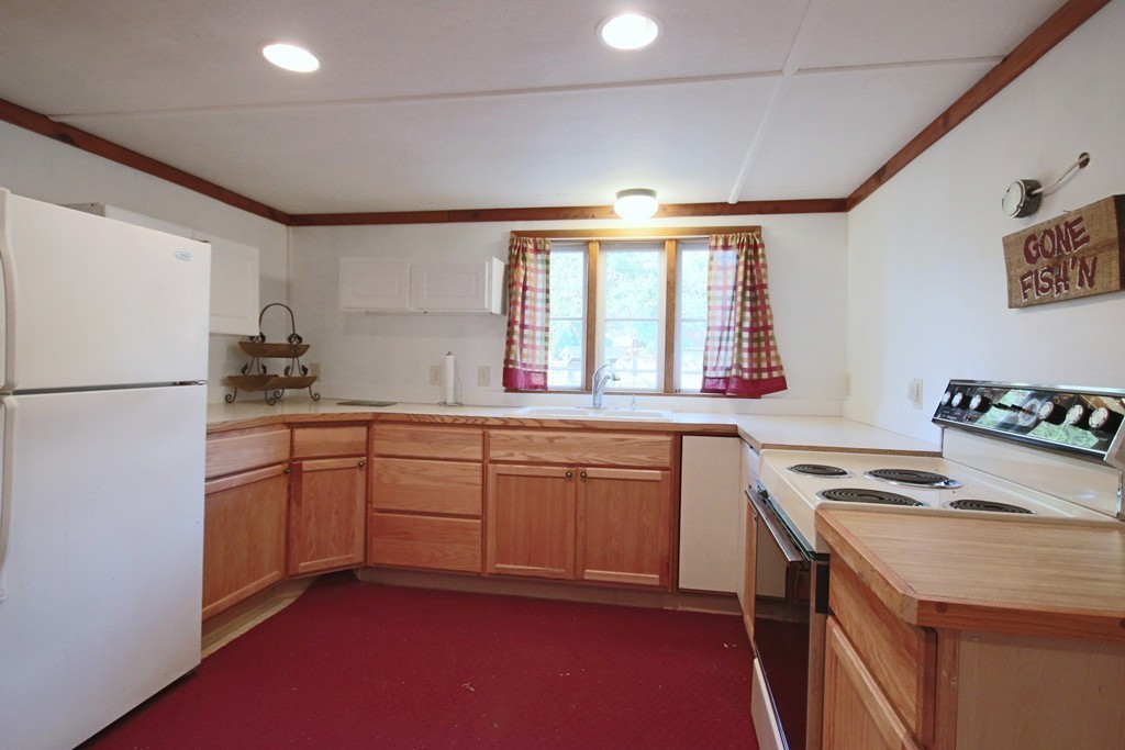 1 Bisson Lane Merrimac, MA 01860 - Photo 7 of 30 a kitchen with stainless steel appliances granite countertop a sink stove and refrigerator