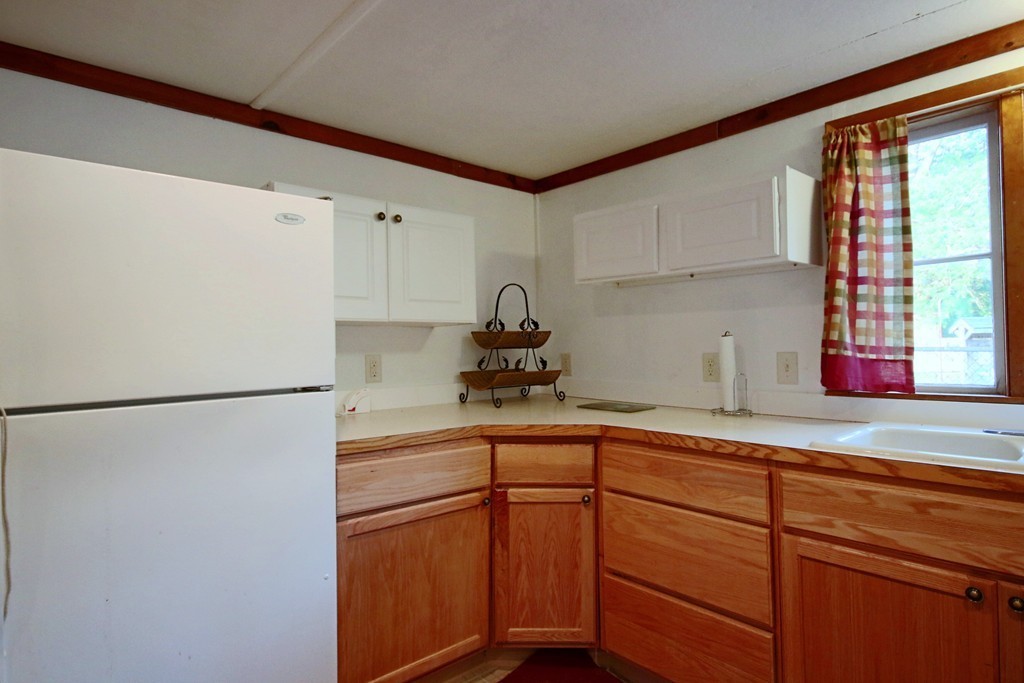 1 Bisson Lane Merrimac, MA 01860 - Photo 8 of 30 a kitchen with a refrigerator and a sink