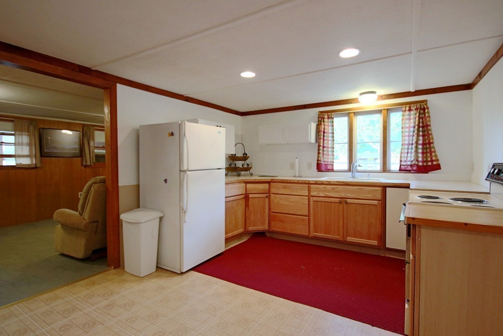1 Bisson Lane Merrimac, MA 01860 - Photo 10 of 30 a kitchen with refrigerator and cabinets
