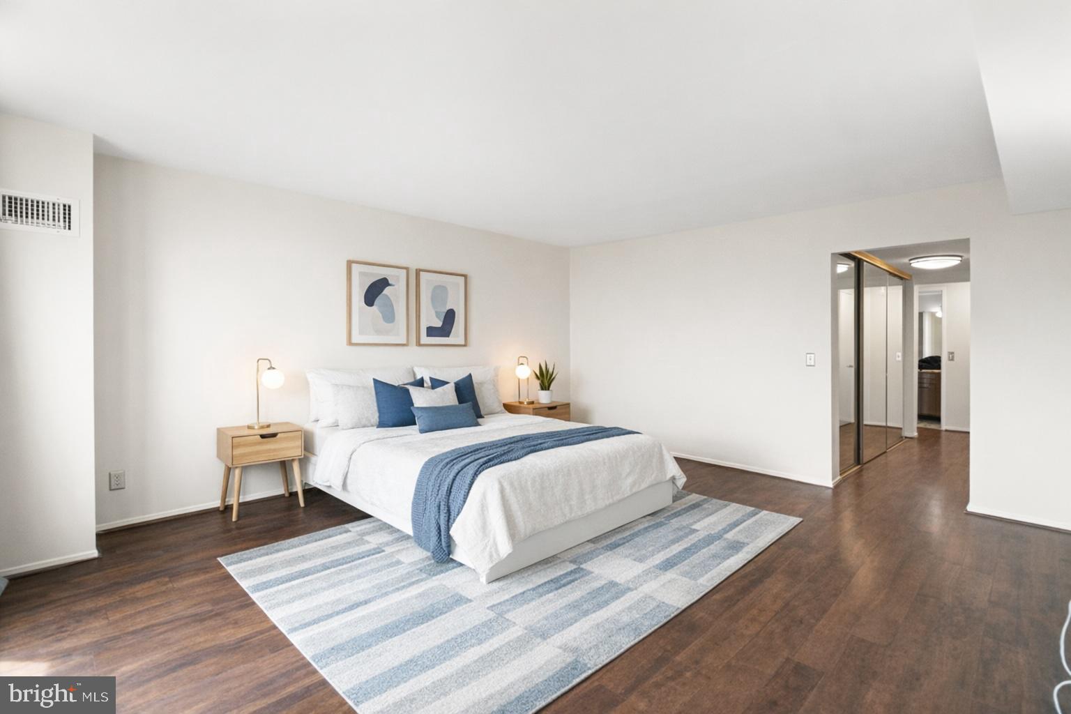 6101 Edsall Road, Unit 1209 Alexandria, VA 22304 - Photo 16 of 35 a bed room with a bed and painting on the wall