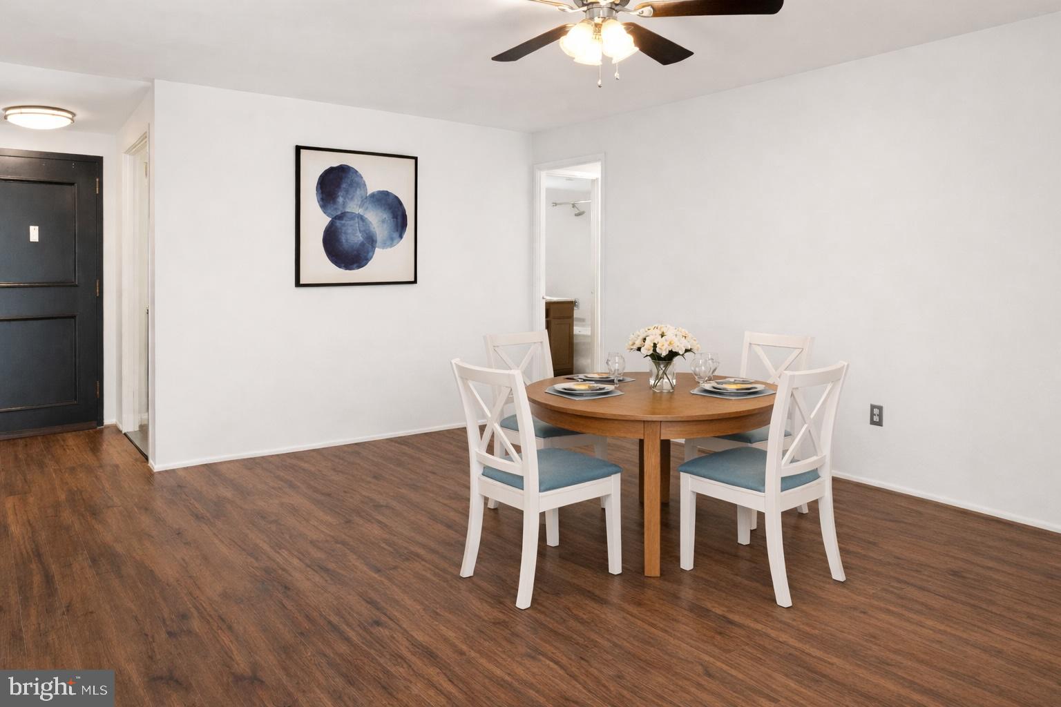 6101 Edsall Road, Unit 1209 Alexandria, VA 22304 - Photo 5 of 35 a dining room with furniture a chandelier and wooden floor