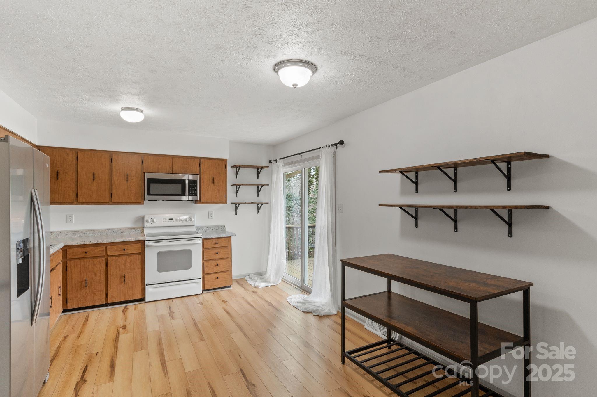 14 South Ridge Place Arden, NC 28704 - Photo 13 of 32 a view of a kitchen with microwave and cabinets