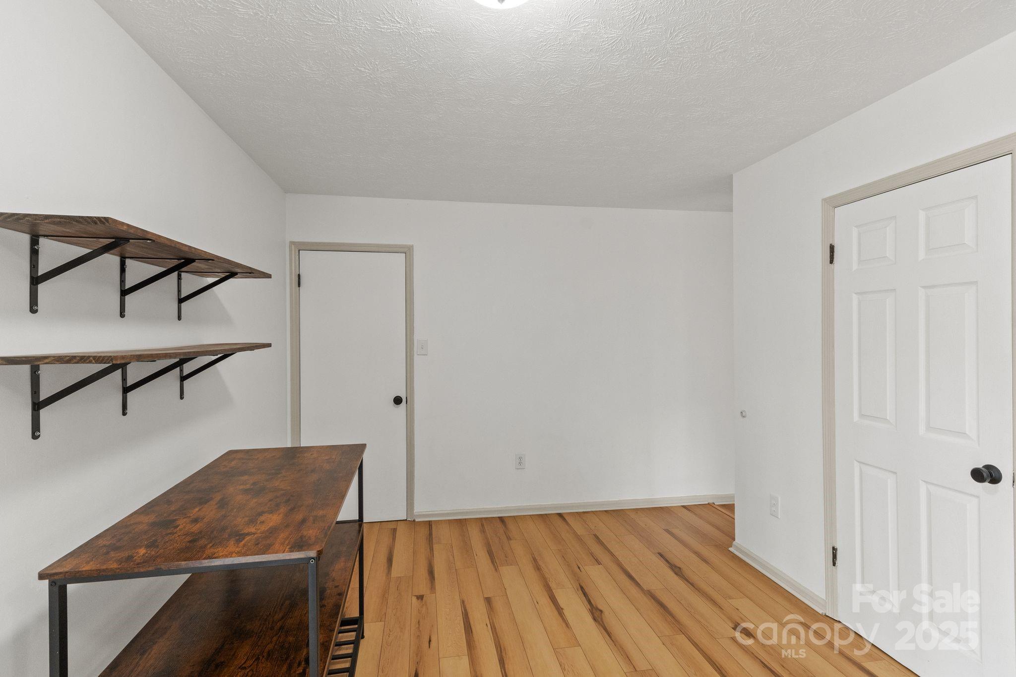 14 South Ridge Place Arden, NC 28704 - Photo 14 of 32 a view of a livingroom with furniture and wooden floor